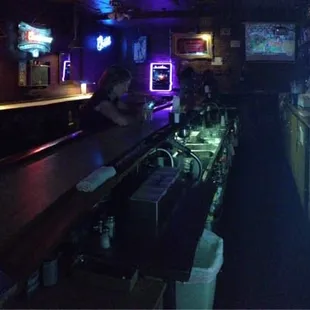 a woman sitting at a bar