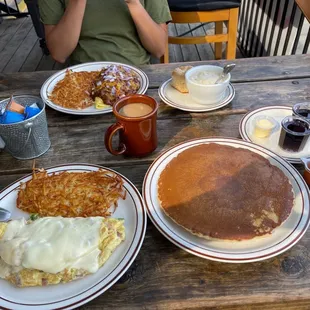 Close: Denver omelette with pancakes Far: chili omelette with biscuits and gravy.