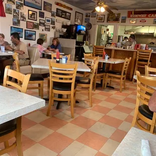 people sitting at tables and eating