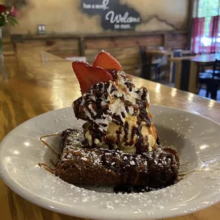 Homemade chocolate brownie with ice cream and homemade whip cream
