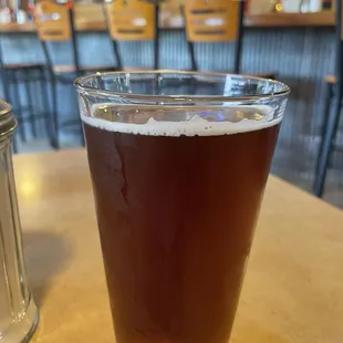 a glass of beer on a table
