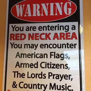 a warning sign for red neck area