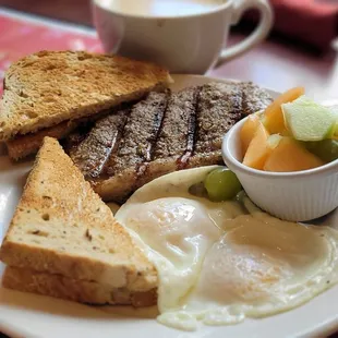 Steak and Eggs with side of fruit and buttered rye $19