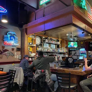 people sitting at the bar