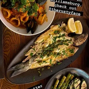 Whole sea bass, grilled vegetables and mixed seafood pasta, really terrific