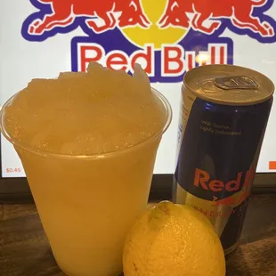 a can of red bull and a lemon