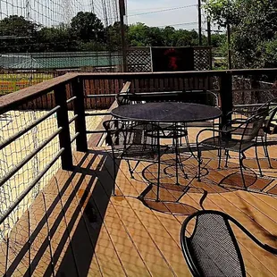 a table and chairs on a deck