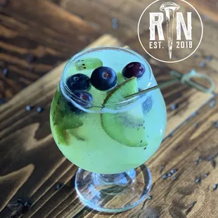 Higher Truth: A great summer cocktail featuring American Gin, kiwi, &amp; blueberries.