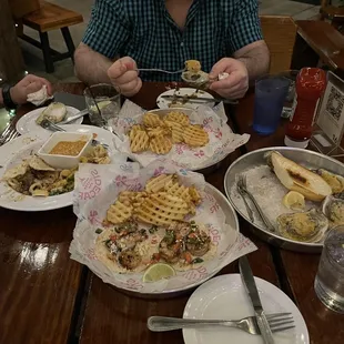 Seafood platter, steak tacos, shrimp tacos, and bbq oysters