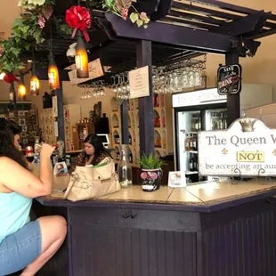 a woman sitting at the bar