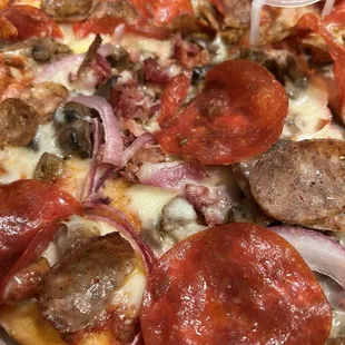 Hot Carnivore Pizza + mushrooms and red onions.