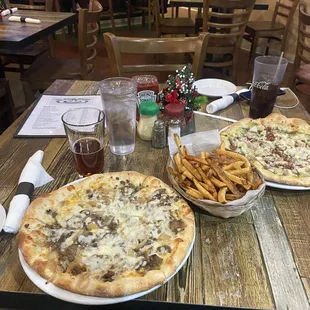 Cheese Steak D-Light Pizza with fries.