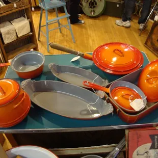 A large set of vintage Le Crueset cookware.