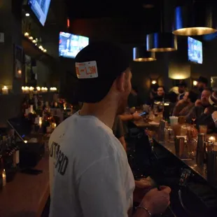 a group of people sitting at a bar