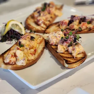 four pieces of toasted bread on a plate