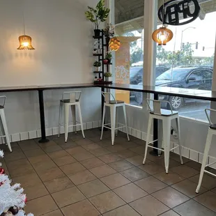 a white christmas tree in the corner of a restaurant