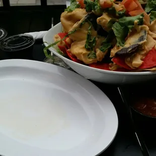 A dirty plate to go along with the most disgusting nachos ever. Very suitable I'd say.
