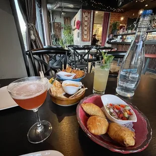 A Damn Mango cocktail Spiral Curry Puffs Chicken Crispy Roti with Curry Sauce Fried Chicken Wings