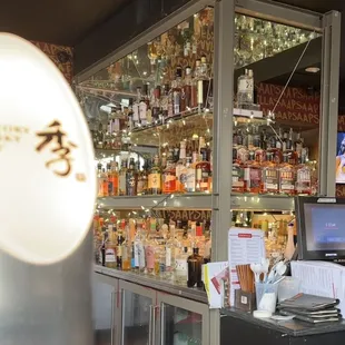 Toki highball machine with their incredible whiskey collection in the back (also Steph Curry )