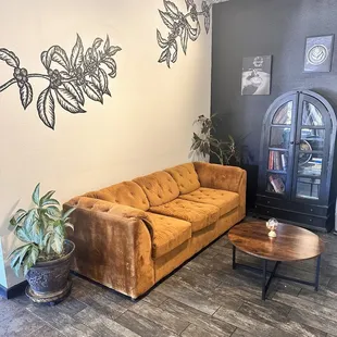 a living room with a couch and coffee table