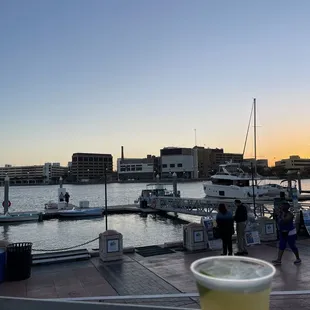 a drink in a plastic cup on a dock