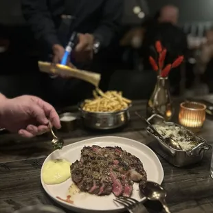 12oz. prime boneless ribeye with aerated table side bearnaise sauce, bone marrow fries and brussel sprouts