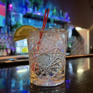 a glass of water with a slice of lime