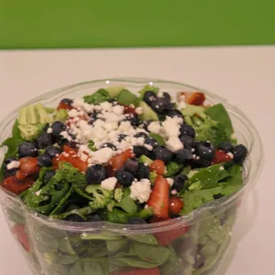 a salad in a plastic bowl