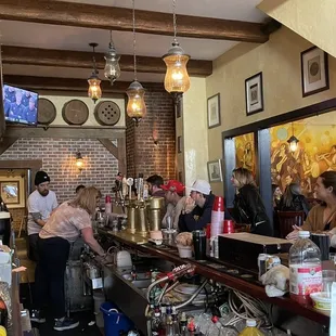 a group of people at the bar