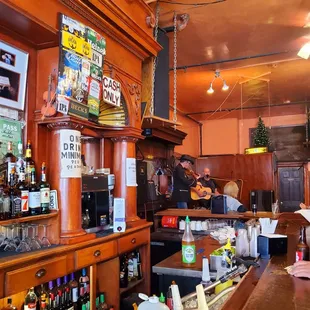 a bar with alcohol bottles on the counter