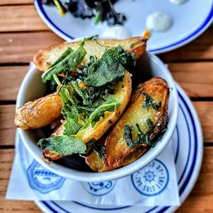 CONFIT FRENCH LA RATTE POTATOES: confit in duck fat, smoked sea salt, fried sage leaf. $10