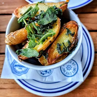 CONFIT FRENCH LA RATTE POTATOES: confit in duck fat, smoked sea salt, fried sage leaf. $10