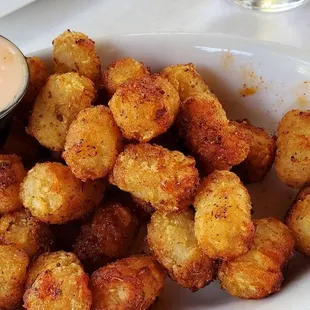 a bowl of fried tater tots