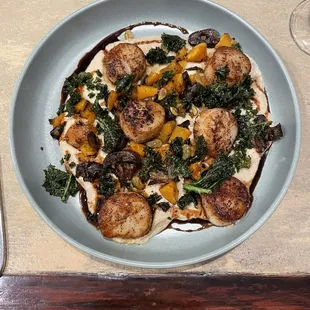 Seared scallops, crispy kale, mushrooms, butternut squash