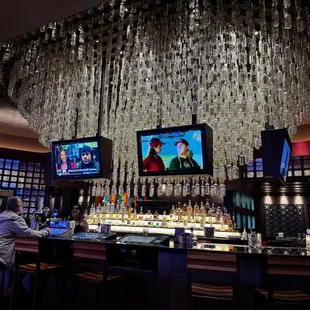 Chandelier is made from tequila bottles.