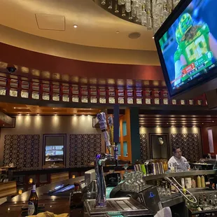 a restaurant with a large screen tv