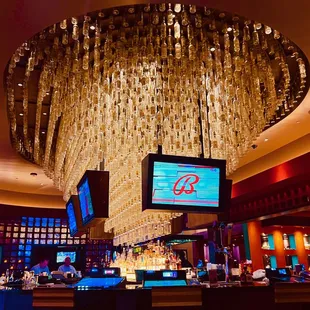 hundreds of glass bottles over bar