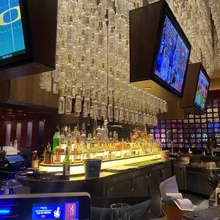 a bar with a large television