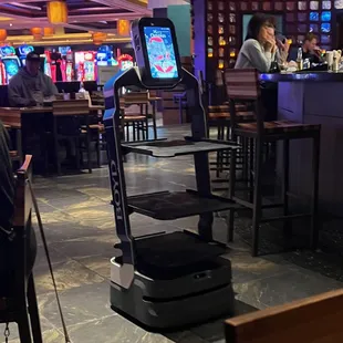 robot coming back after dropping off food