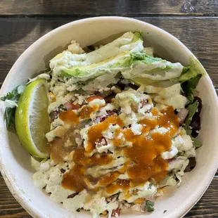 Rice bowl with no rice, greens instead for low carb. Added avocado and one of the many hot sauce options.