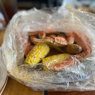 crab legs and corn on the cob