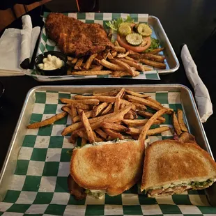 In the distance a giant pork tenderloin samich, up close a turkey melt.