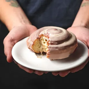 a person holding a donut