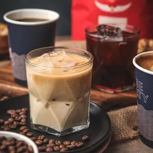 a cold drink with ice and coffee beans