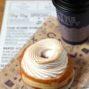 a cup of coffee and a pastry
