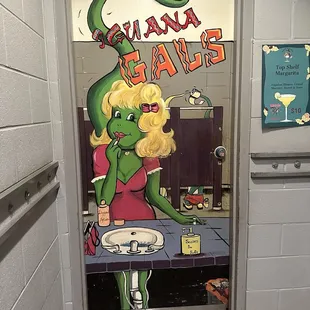 a bathroom door with a cartoon character painted on it