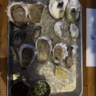 A dozen delicious oysters, sadly sideways and partially eaten, and in a bit of a shadow, but were so good!