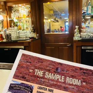 Menu with full bar in the background.