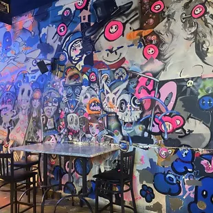 a colorful mural on the wall of a restaurant