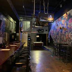 a bar with tables and stools